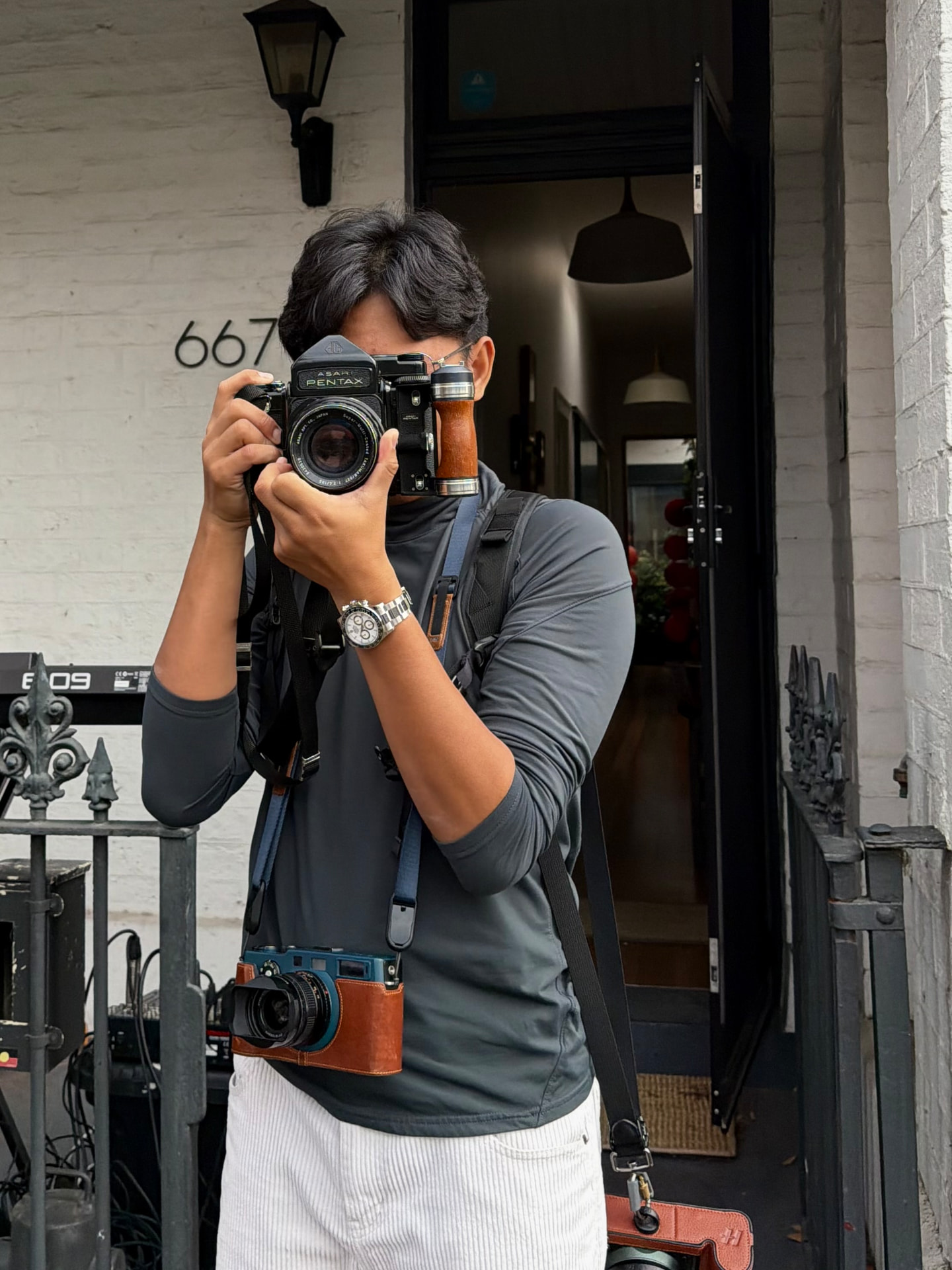 Harry Liu shooting a Pentax 67 in the street